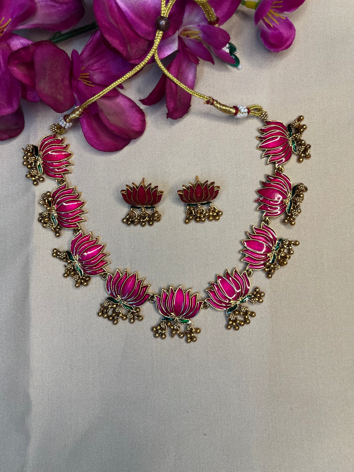 Lotus choker with golden droplet