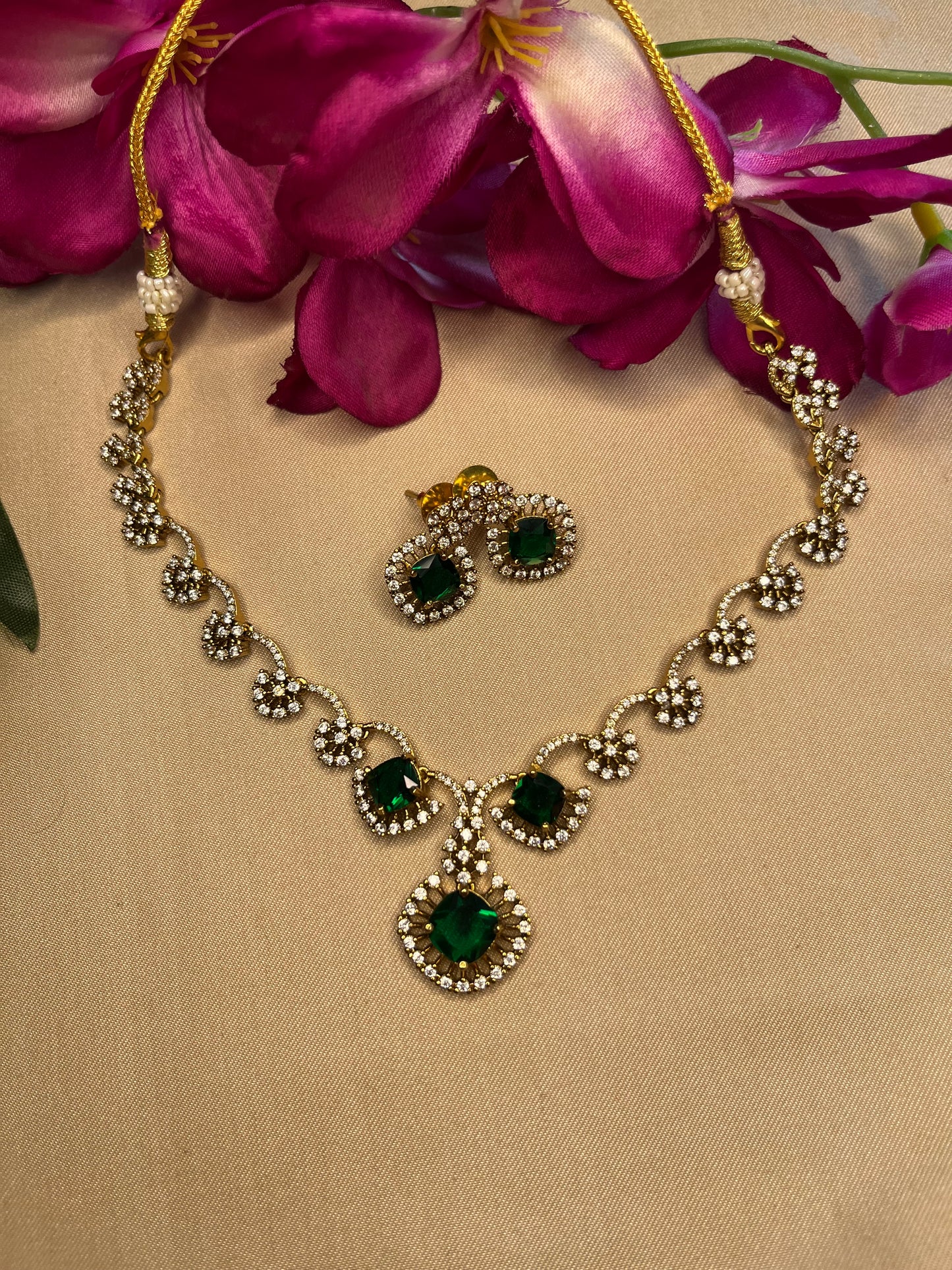 Emerald and white stone half flower choker