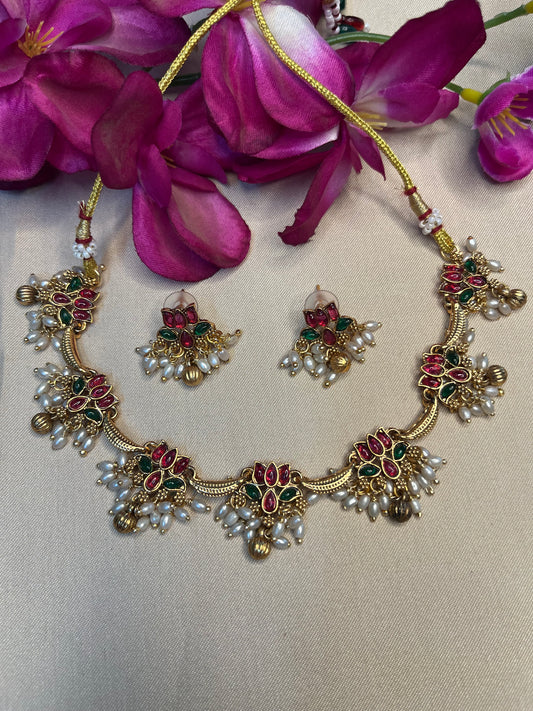Lotus with pearl danglers