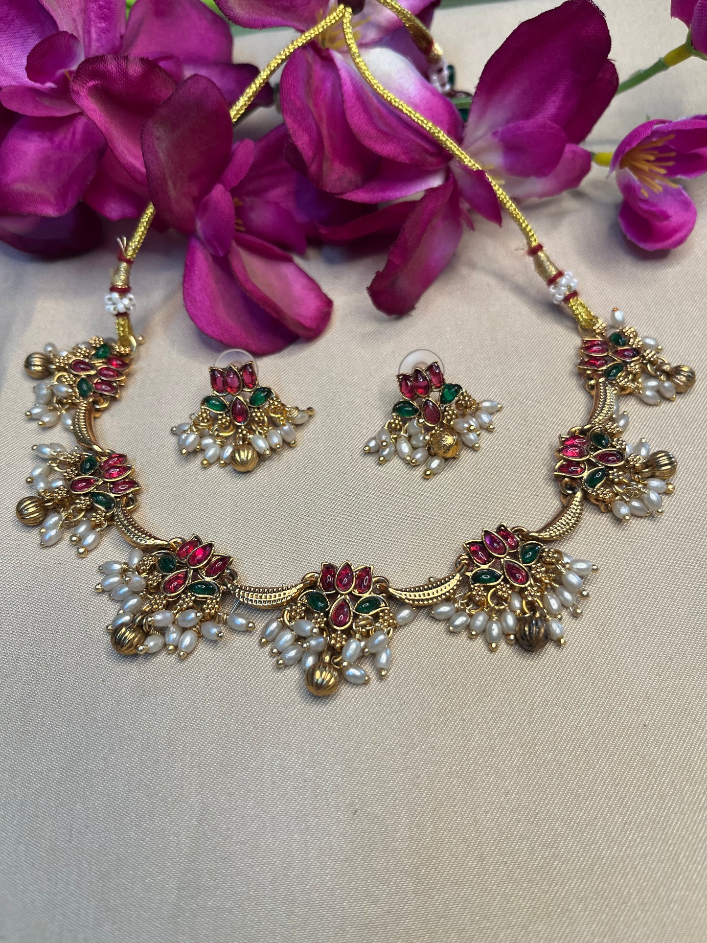 Lotus with pearl danglers