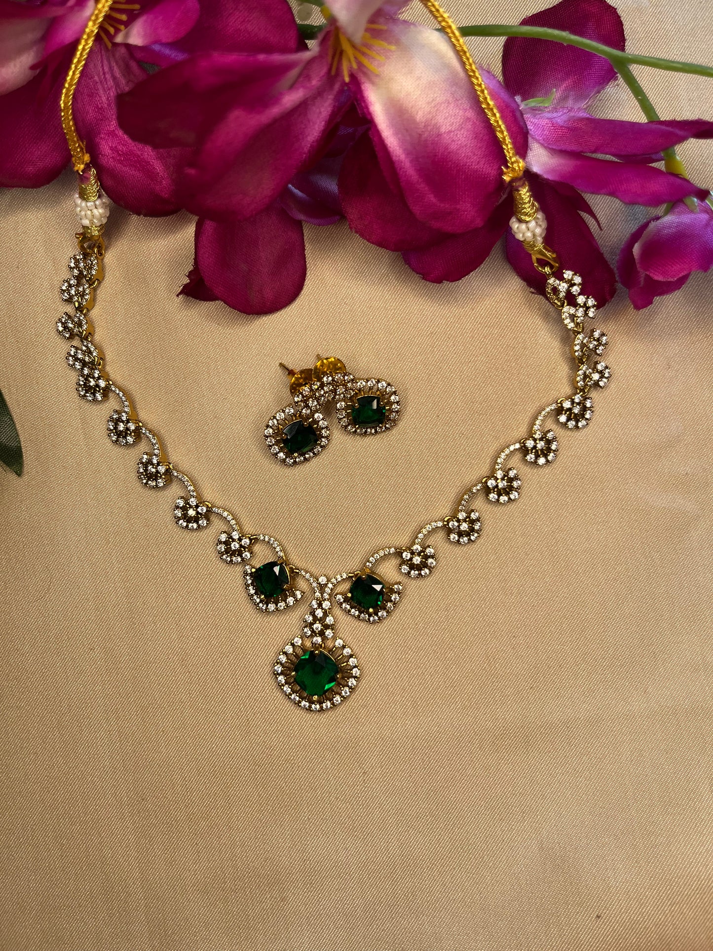 Emerald and white stone half flower choker