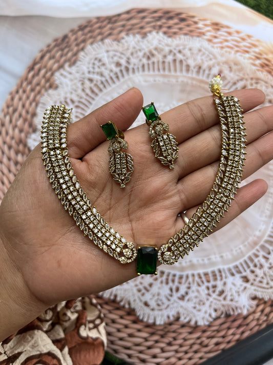 Emerald Majesty: Antique Gold Choker Set with white Stone